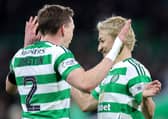 Alistair Johnston and Daizen Maeda celebrate the Celtic win over Aberdeen.