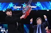 Elon Musk brandishes a chainsaw alongside Argentinian President Javier Milei during the annual Conservative Political Action Conference (CPAC) in Oxon Hill, Maryland (Picture: Saul Loeb)