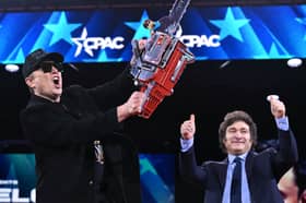 Elon Musk brandishes a chainsaw alongside Argentinian President Javier Milei during the annual Conservative Political Action Conference (CPAC) in Oxon Hill, Maryland (Picture: Saul Loeb)