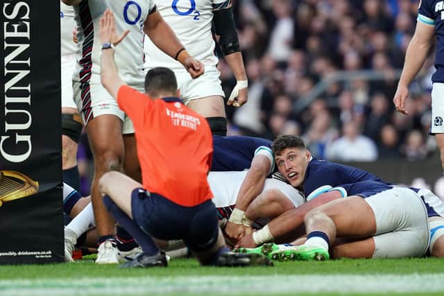 Referee Pierre Brousset awards a try for England's Tommy Freeman during the Guinness Men's Six Nations win over Scotland at Allianz Stadium, London.