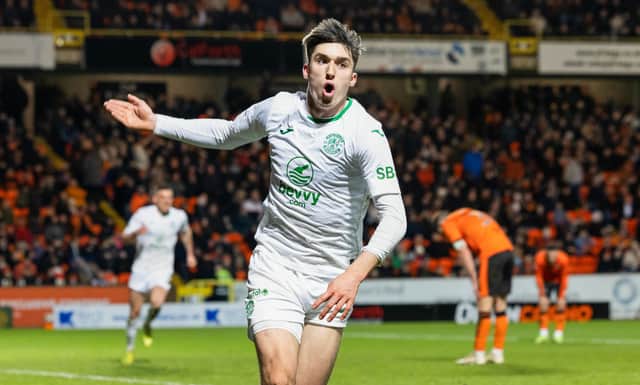 Hibs substitute Kieron Bowie celebrates after scoring to make it 2-1 over Dundee United at Tannadice in the 90th minute. (Photo by Ross Parker / SNS Group)