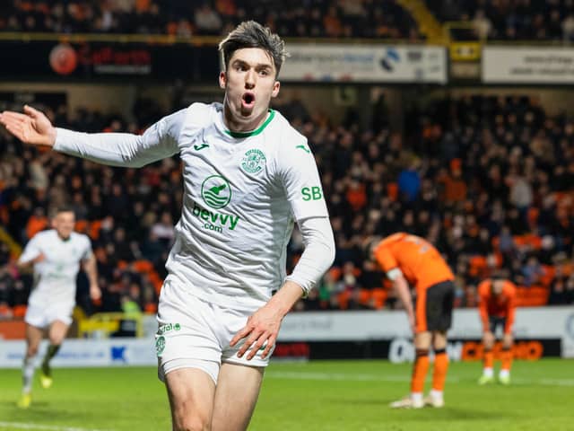Hibs substitute Kieron Bowie celebrates after scoring to make it 2-1 over Dundee United at Tannadice in the 90th minute. (Photo by Ross Parker / SNS Group)