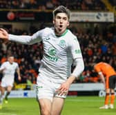 Hibs substitute Kieron Bowie celebrates after scoring to make it 2-1 over Dundee United at Tannadice in the 90th minute. (Photo by Ross Parker / SNS Group)