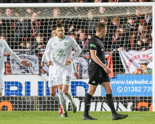 Nicky Cadden complains to referee David Dickinson after Dundee United's Sam Dalby's 'goal' against Hibs last night.
