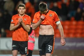 Dundee United's Declan Gallagher looks dejected at full time after the 3-1 defeat to Hibs at Tannadice. (Photo by Paul Devlin / SNS Group)