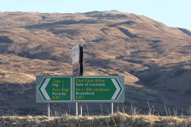 A replica of this bi-lingual roadsign in Skye, which marks a junction on a key tourist route on the island, is also included in the project.