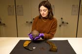Dr Sarah Laurenson, of National Museums Scotland, with some of the items in the national collection to have their Gaelic origins retold and reinforced. PIC: Duncan McGlynn