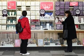 Two women look at a jewellery shop window in Stevenage, north of London, in 2024 (Photo: JUSTIN TALLIS/AFP via Getty Images)