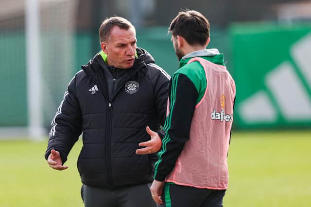 Celtic manager Brendan Rodgers offers advice to Greg Taylor.