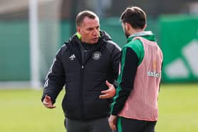 Celtic manager Brendan Rodgers offers advice to Greg Taylor.