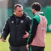 Celtic manager Brendan Rodgers offers advice to Greg Taylor.