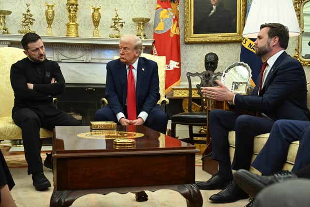 US President Donald Trump and Ukraine's President Volodymyr Zelensky listen to Vice President JD Vance as they meet in the Oval Office of the White House in Washington