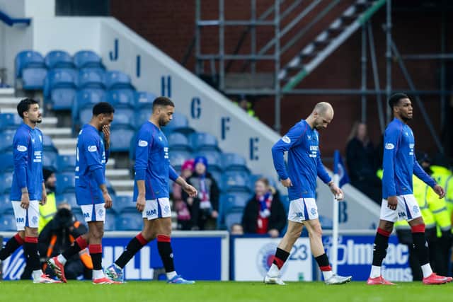 The Rangers players trudge off after the defeat by Motherwell.