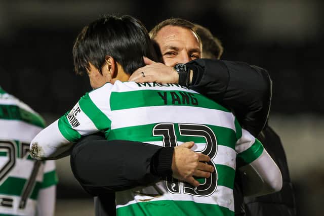 Brendan Rodgers celebrates with Yang.