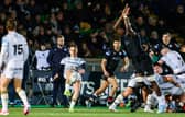 Glasgow Warriors' Jare Oguntibeju attempts to block Ospreys' Kieran Hardy's drop kick.