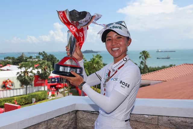 Lydia Ko shows off the HSBC Women's World Championship trophy after her win at Sentosa Golf Club in Singapore