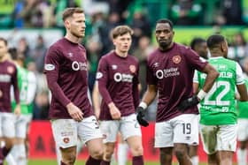 Hearts players Jamie McCart (L) and Elton Kabangu (R) look dejected at full-time after the 2-1 defeat to Hibs. (Photo by Mark Scates / SNS Group)