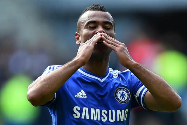 Chelsea's English defender Ashley Cole gestures to Chelsea fans following the English Premier League football match between Cardiff City and Chelsea at the Cardiff City Stadium in Cardiff on May 11, 2014.