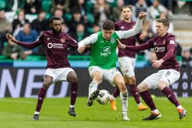 Hibs' Nectarios Triantis battles against the Hearts midfielder in Sunday's crucial 2-1 Edinburgh derby victory. Cr: SNS Group.