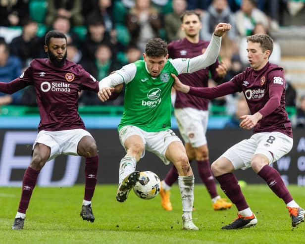 Hibs' Nectarios Triantis battles against the Hearts midfielder in Sunday's crucial 2-1 Edinburgh derby victory. Cr: SNS Group.