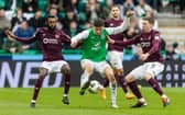 Hibs' Nectarios Triantis battles against the Hearts midfielder in Sunday's crucial 2-1 Edinburgh derby victory. Cr: SNS Group.