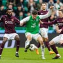 Hibs' Nectarios Triantis battles against the Hearts midfielder in Sunday's crucial 2-1 Edinburgh derby victory. Cr: SNS Group.