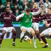 Hibs' Nectarios Triantis battles against the Hearts midfielder in Sunday's crucial 2-1 Edinburgh derby victory. Cr: SNS Group.