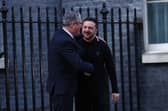 Keir Starmer embraces Volodymyr Zelensky in Downing Street on Saturday in stark contrast to the disgraceful treatment of the Ukrainian president by Donald Trump in Washington last week (Picture: Peter Nicholls)