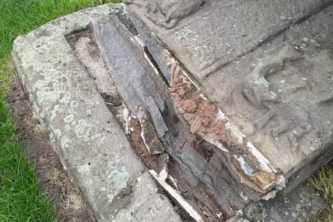The Aberlemno 3 after it toppled, with the stone completely splitting from its base.