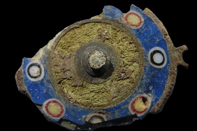 The Roman brooch found deep in the foundations of an Iron Age settlement. The item was buried in the second century AD. Picture: GUARD Archaeology.