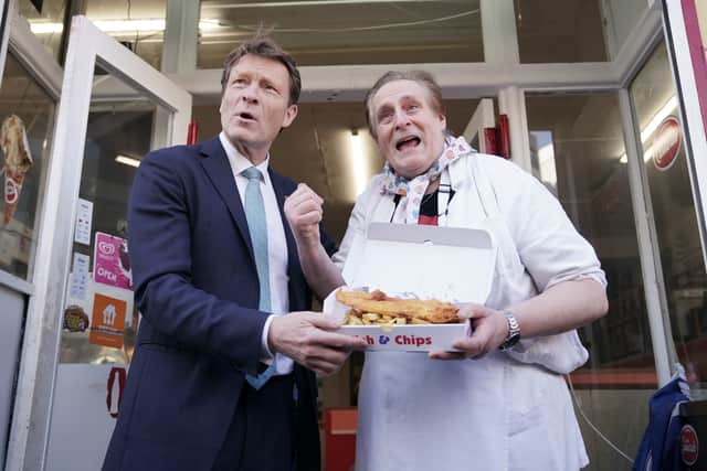   Reform UK deputy leader Richard Tice MP with co-owner Rico Corvi during a visit to Vald'oro Chip shop in Glasgow 