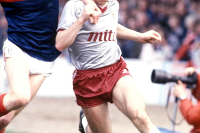Dundee's Colin Hendry (left) tackles John Colquhoun of Hearts back in 1986.