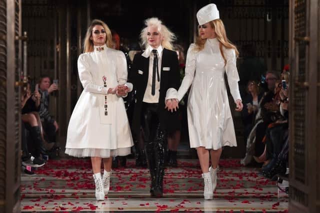 Pam Hogg flanked by models Alice Dellal and Fearne Cotton at her London Fashion Week show, 2017.