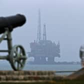 An oil rig is towed by tugboats off the coast of Hartlepool on its way to be decommissioned (Picture: Scott Heppell)