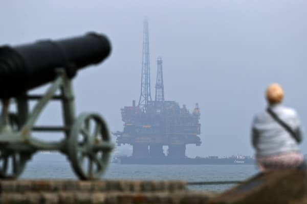 An oil rig is towed by tugboats off the coast of Hartlepool on its way to be decommissioned (Picture: Scott Heppell)