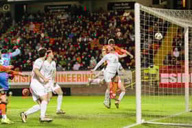 Dundee United's Sam Dalby scores against Hibs before his goal was ruled out following a lengthy VAR check. (Photo by Paul Devlin / SNS Group)