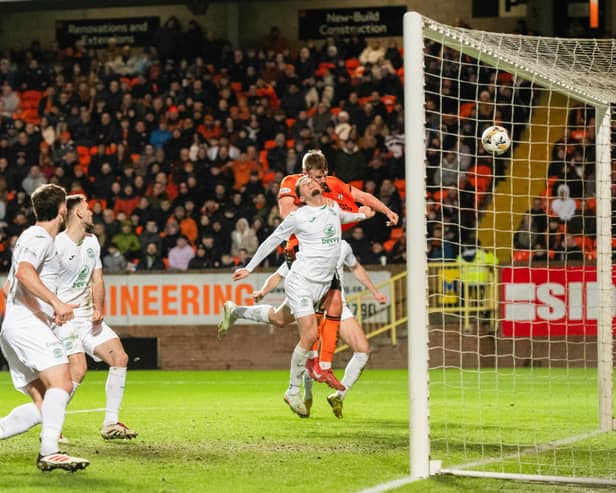 Dundee United's Sam Dalby scores against Hibs before his goal was ruled out following a lengthy VAR check. (Photo by Paul Devlin / SNS Group)