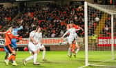 Dundee United's Sam Dalby scores against Hibs before his goal was ruled out following a lengthy VAR check. (Photo by Paul Devlin / SNS Group)