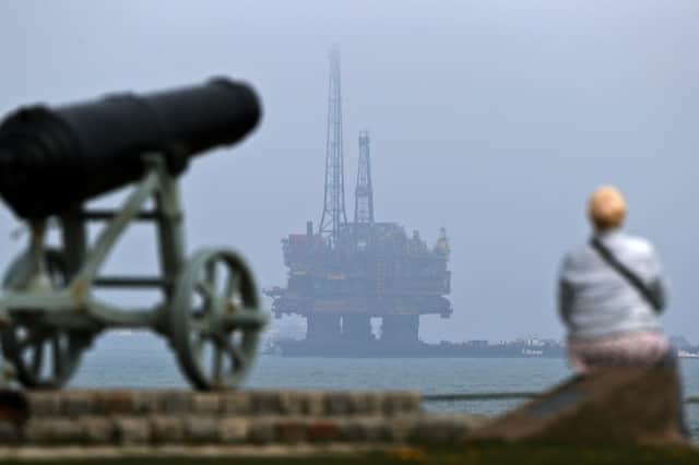 An oil rig is towed by tugboats off the coast of Hartlepool on its way to be decommissioned (Picture: Scott Heppell)