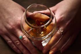 A cauld cock and feather is a drink made with brandy  and raisins