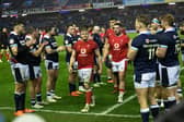 The Wales team are applauded off the pitch by Scotland.