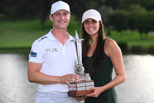 Calum Hill shows off the Joburg Open trophy along with his wife Miranda after landing a dramatic second DP World Tour title triumph on Sunday 