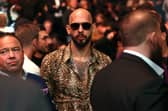 Andrew Tate, wearing sunglasses, attended an Ultimate Fighting Championship match in Las Vegas on Saturday (Picture: Ian Maule)