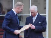 King Charles with Sir Chris Hoy during the launch of the Commonwealth Sport King's Baton Relay at Buckingham Palace on Monday (Picture: Jonathan Brady)