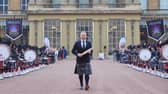 Sir Chris Hoy holding the Commonwealth baton at the launch of the Commonwealth Sport King's Baton Relay, officially starting the countdown towards the Glasgow 2026 Commonwealth Games at Buckingham Palace, London