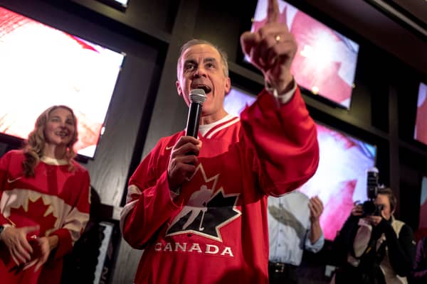 Mark Carney, who has since become Canada's Prime Minister and Liberal leader, speaks to supporters at a party to watch an ice hockey game against the US last month (Picture: Andrej Ivanov)