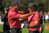 Tiger Woods celebrates with son Charlie after making a the first hole-in-one of his career during the PNC Championship at Ritz-Carlton Golf Club in Florida last December