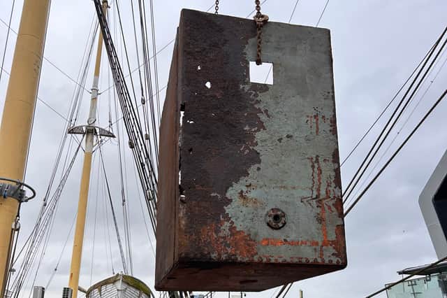 One of the water tanks being removed