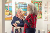 Virginie Barrou Planquart from Galerie Barrou Planquart in Paris, discussing her artists' work with a visitor to Edinburgh Art Fair