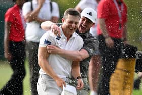 Calum Hill is congratulated by Connor Syme after his play-off win in the Joburg Open at Houghton Golf Club